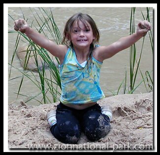 My daughter plays by the river along the Pa'rus Trail