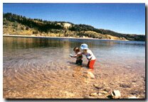 Children playing at Navajo Lake on Cedar Mountain